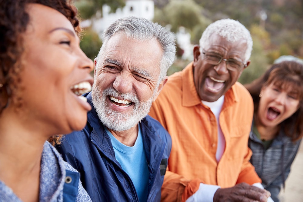 Friends laughing together outdoors